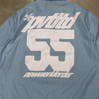 Close-up of the 55 varsity numbering on the PVTLTD* Rush Hour Blue Shirt back