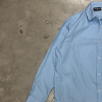PVTLTD* Rush Hour Blue Shirt laid on concrete, gingham check and chest logo