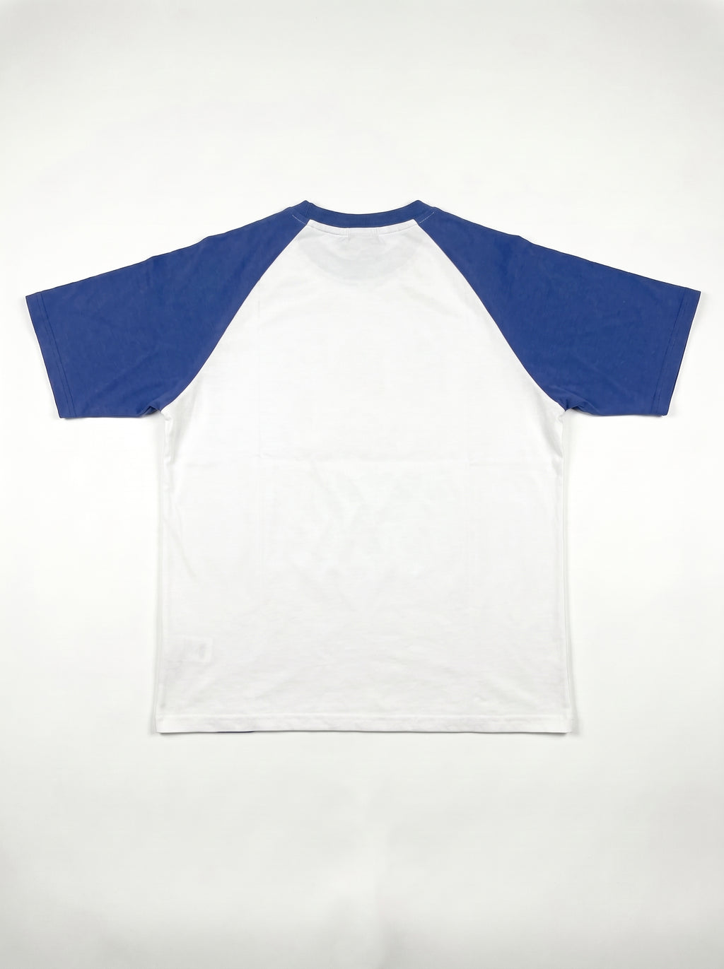 Blue Raglan Tee back flat lay, plain white body with royal blue raglan sleeves, PVTLTD*
