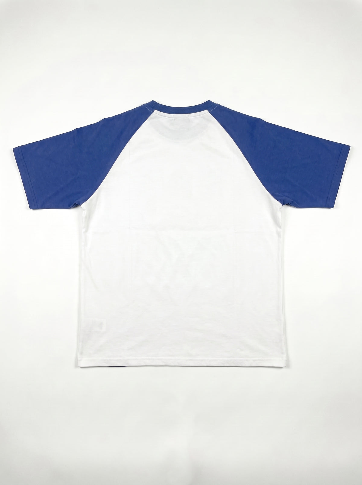 Blue Raglan Tee back flat lay, plain white body with royal blue raglan sleeves, PVTLTD*