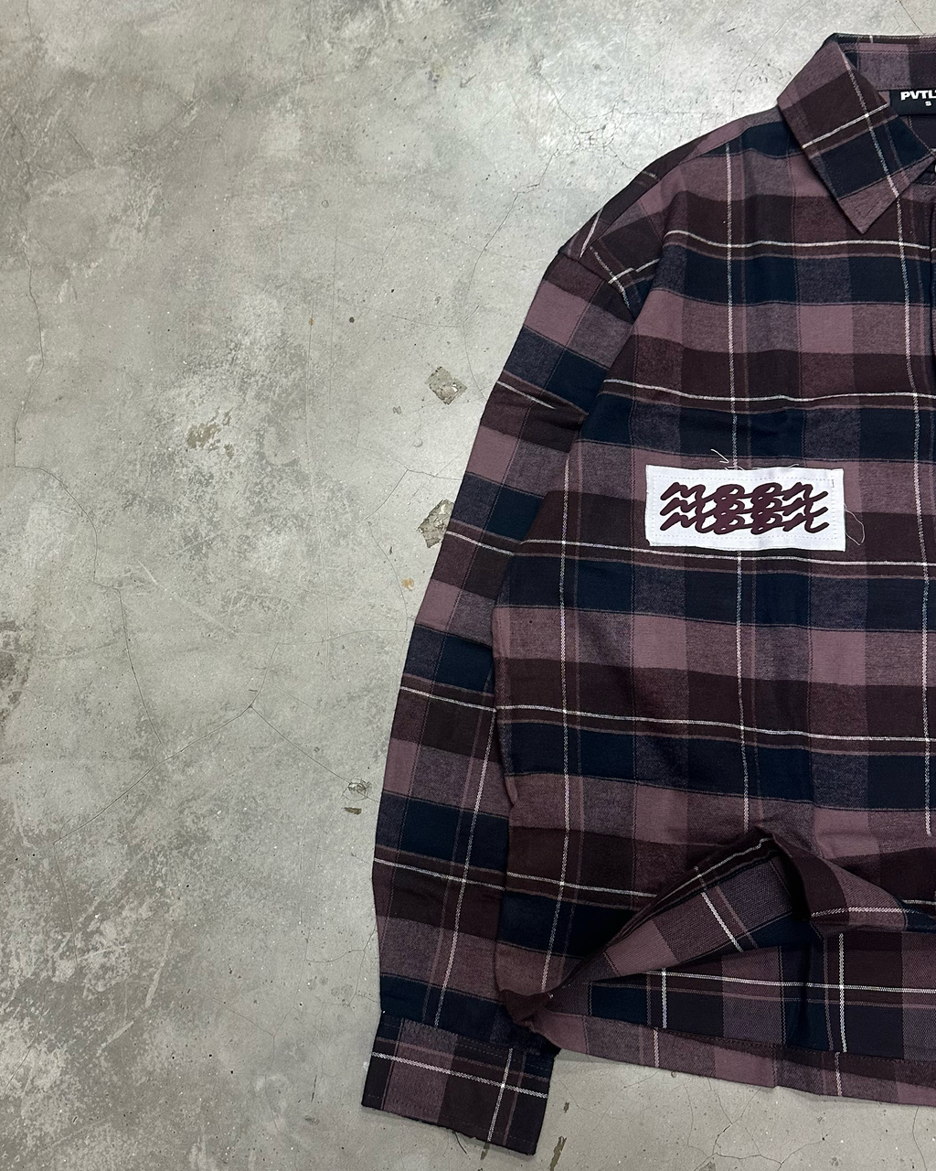PVTLTD* Cosmic Flannel on concrete, wave patch on the chest and buttoned cuff