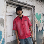 Model wearing the PVTLTD* Legacy Shirt in washed crimson, relaxed fit, styled with denim