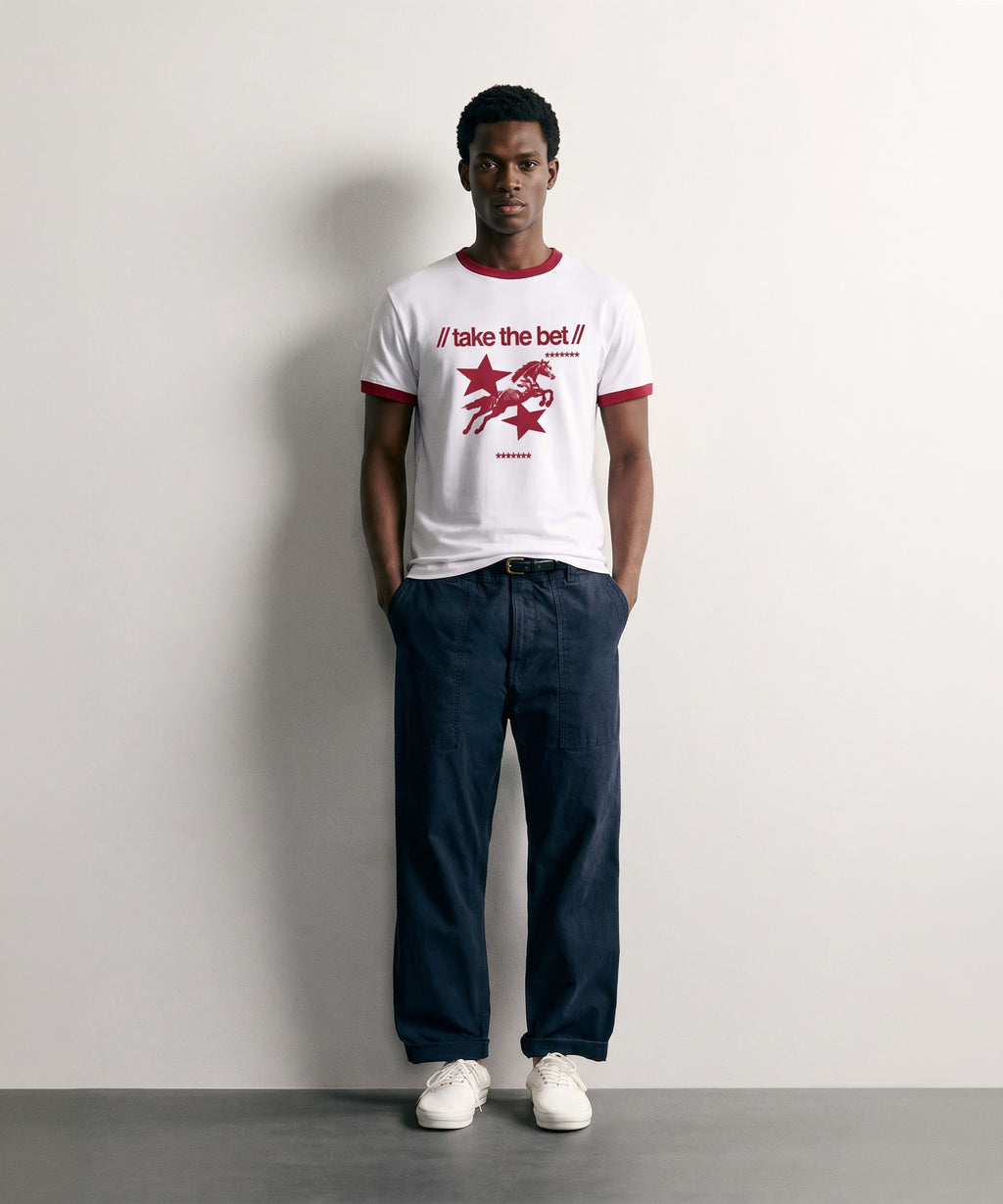 Model wearing the PVTLTD* Horsebet Slim Fit Tee, white ringer tee with red trim and take the bet horse print, front view