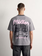 Mansion Tee back on model, oversized pink Mansion script over a mansion illustration, PVTLTD*