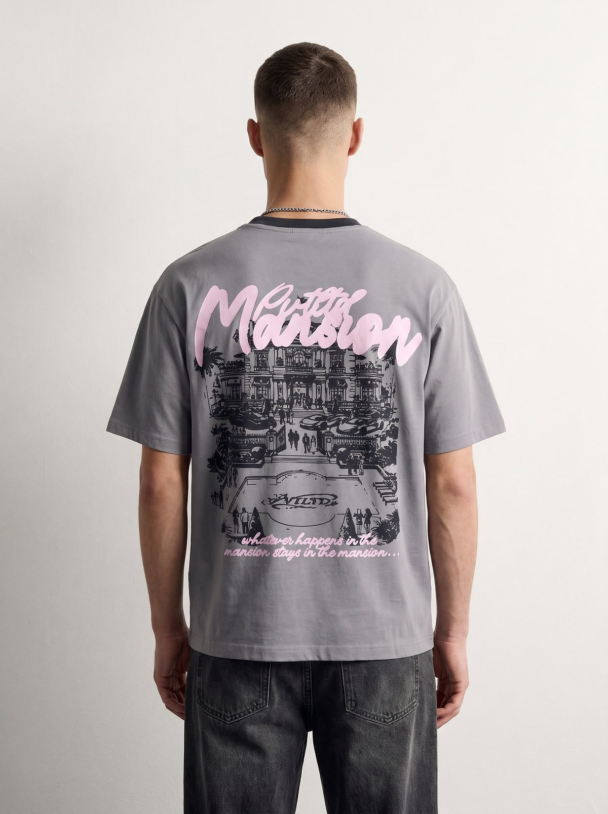 Mansion Tee back on model, oversized pink Mansion script over a mansion illustration, PVTLTD*
