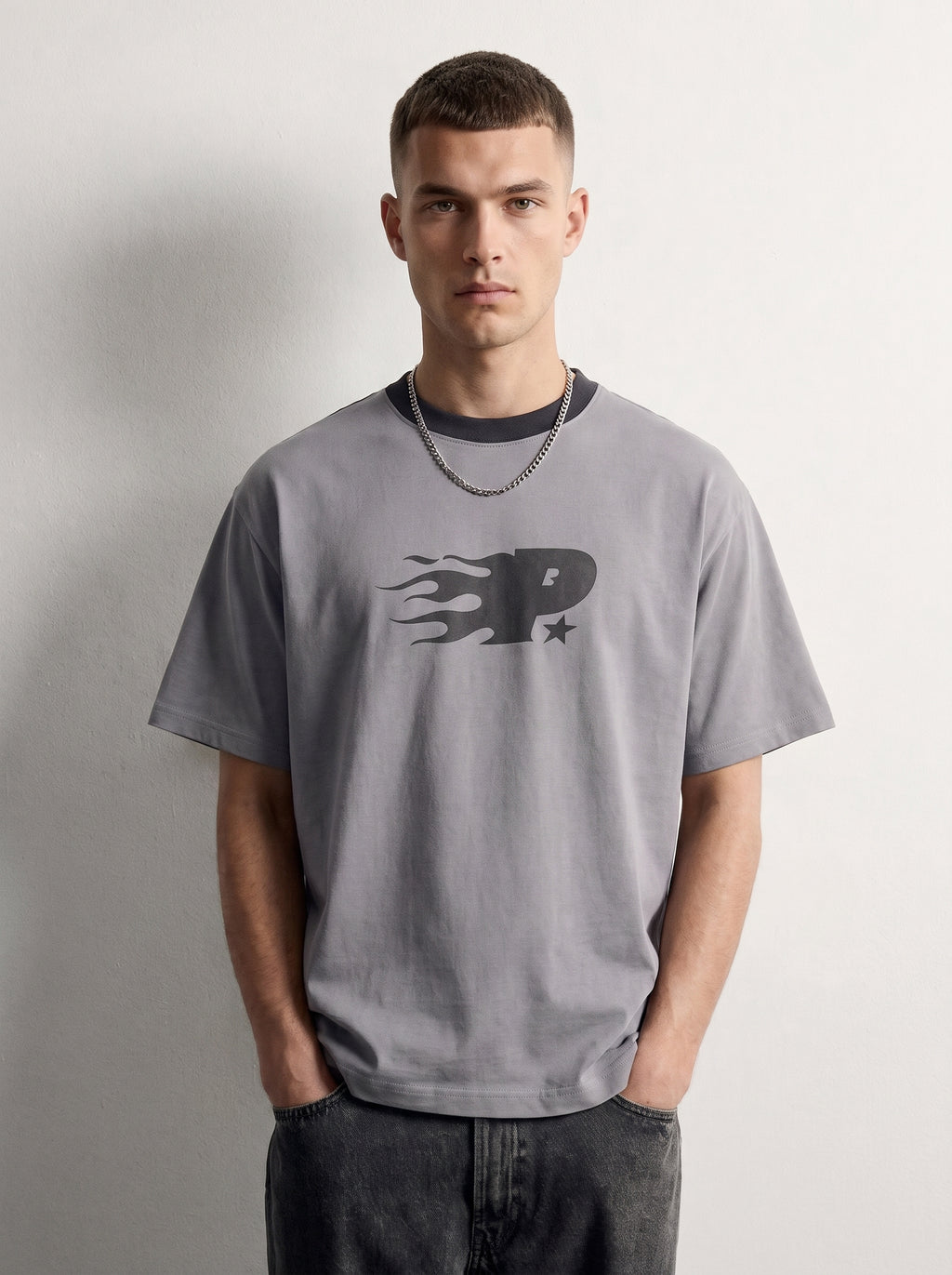 PVTLTD* Mansion Tee, close-up of the flame-trail P chest print on ice grey