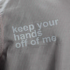 Graphic hand print detail on the PVTLTD* Keep Your Hands Off Me Shirt