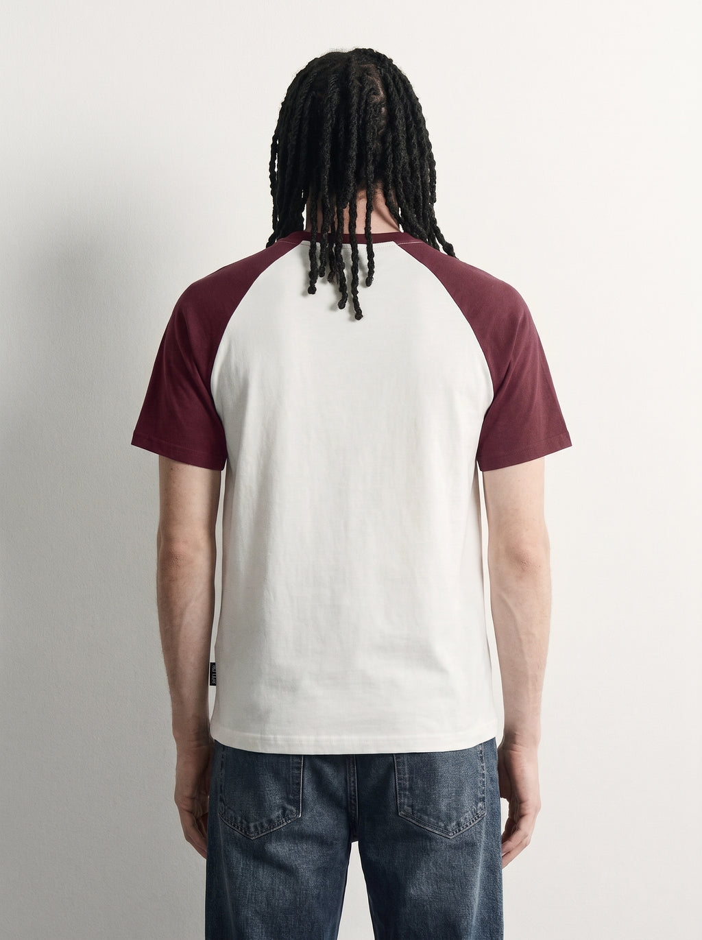 Red Raglan Tee back on model, plain off-white body with burgundy raglan sleeves, PVTLTD*
