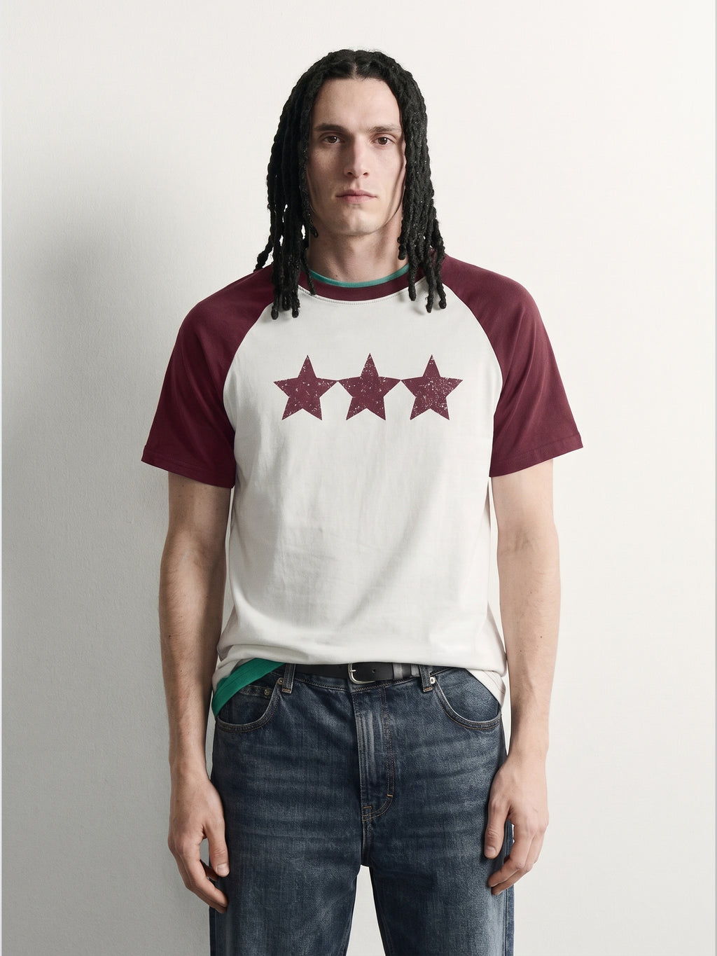 PVTLTD* Red Raglan Tee, close-up of the speckled three-star chest print on the off-white body